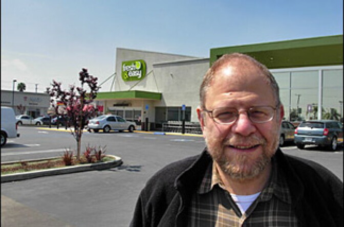 Business commentator Mark Lacter standing in the nearly empty parking lot at the Fresh 'n' Easy store in The Comptons. 