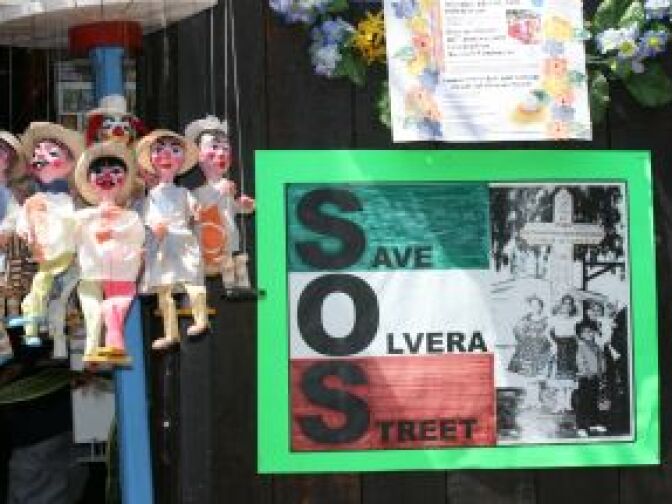 Posters saying "Save Olvera Street" greet visitors to the 80th anniversary celebrations of Olvera Street in downtown Los Angeles on on April 24, 2010.