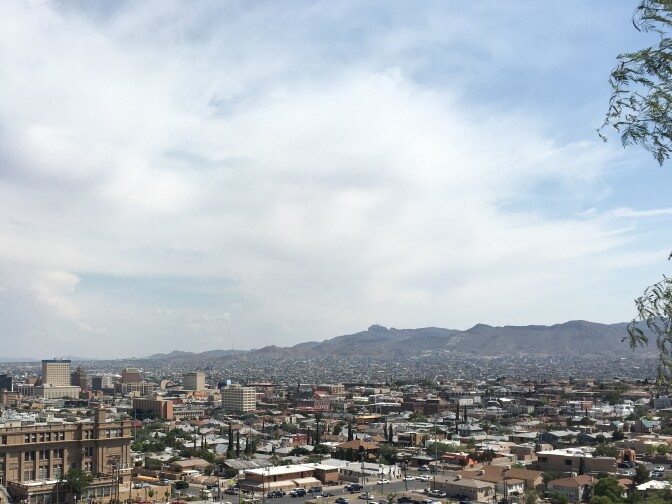 El Paso, Texas, in the foreground, is framed by the jagged mountains of Ciudad Juárez, Mexico, in the background.