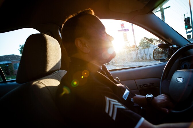 As the sun begins to set, North Hollywood Probation Compliance Unit head Sgt. Glenn McNeil drives to another home visit.