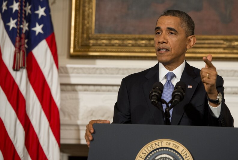 US President Barack Obama speaks about the reopening of the US government following a shutdown, in the State Dining Room of the White House in Washington, DC, on October 17, 2013. Obama warned Thursday that America's political dysfunction had encouraged its enemies and depressed its friends, and said the crisis had left 'no winners' in Washington. Obama called on warring politicians to come together to pass a long term budget and to give up the 'brinksmanship' that threatens the economy and squandered the trust of the American people. 
