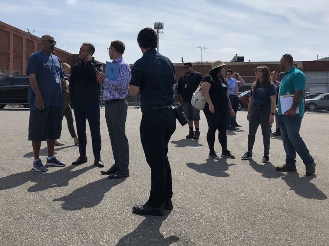 Los Angeles Mayor Eric Garcetti, second from left, and others prepare for homeless outreach in North Hollywood in early July. (Matt Tinoco/KPCC)