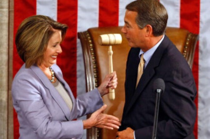 Speaker of the House Nancy Pelosi (D-CA) (L) accepts the gavel from Minority Leader John Boehner (R-OH) during the first session of the 111th Congress in the House Chambers. Will they join forces and let the Bush tax cuts expire?
