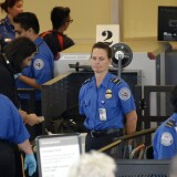 Travelers are screened by Transportation Security Administration agents after Terminal 3 was re-opened a day after a shooting at Los Angeles International Airport November 2, 2013 in Los Angeles, California. The airport is almost back to normal operations a day after a man pulled out an assault rifle and shot his way through security at Terminal 3, killing one Transportation Security Administration worker and wounding several others. Federal officials identified the alleged gunman as Paul Ciancia, 23. 