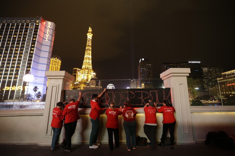 Members of the National Nurses United union hold LED signs to show their support for Democratic presidential candidate Sen. Bernie Sanders, I-Vt., Wednesday, Feb. 17, 2016, in Las Vegas. (AP Photo/Jae C. Hong)
