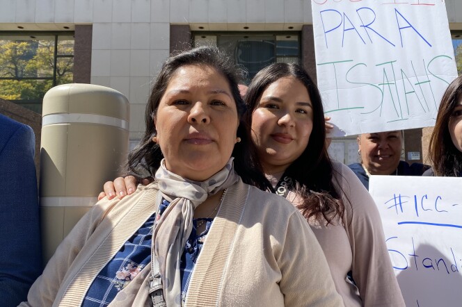 Isaias Cervantes' mother, Rosa Padilla and sister Yajaira Cervantes spoke at a press conference outside the Board of Supervisors' meeting Tuesday. They both wear beige colored tops and look into the camera. A sign behind them reads: "Justicia Para Isaiahs" 