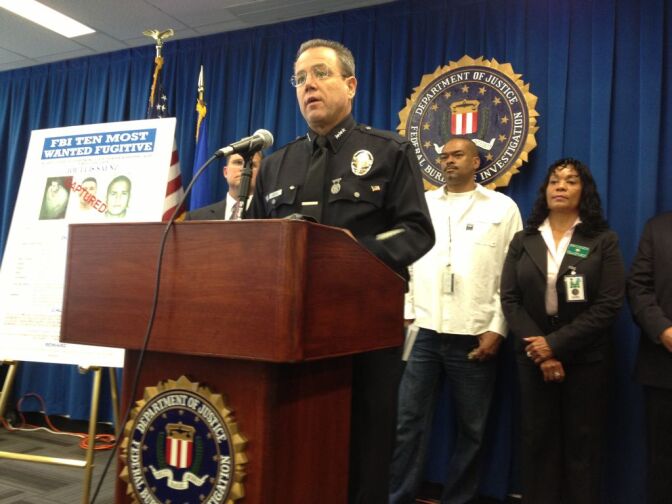 Assistant LAPD Chief Mike Moore briefs the press about the capture of suspected murderer Jose "Joe" Luis Saenz.