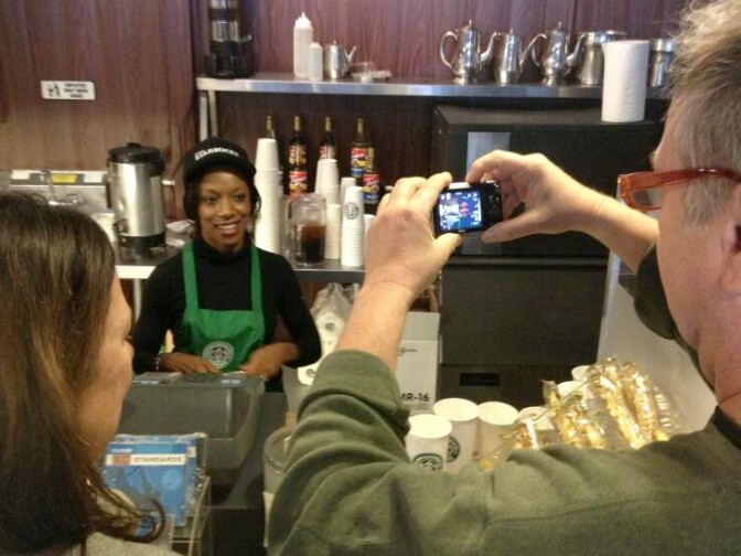 Amber at the Dumb Starbucks counter cheerful despite the onslaught. She can't or won't say what's up with the mystery pop up coffee house. 
