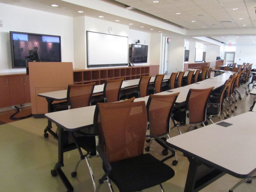 State-of-the-art classrooms inside the new nursing school at Charles Drew University in South L.A. remain empty.  The program's first 25 students are studying inside bungalows on campus.  The university is behind on loan payments and contract language is keeping the building closed.
