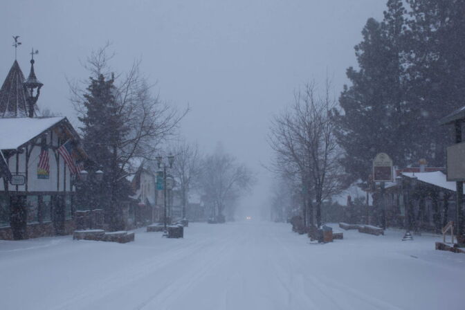 Snow falls at Bear Mountain Ski Resort where police are continuing the hunt for Christopher Dorner, suspected of killing three people in Southern California.