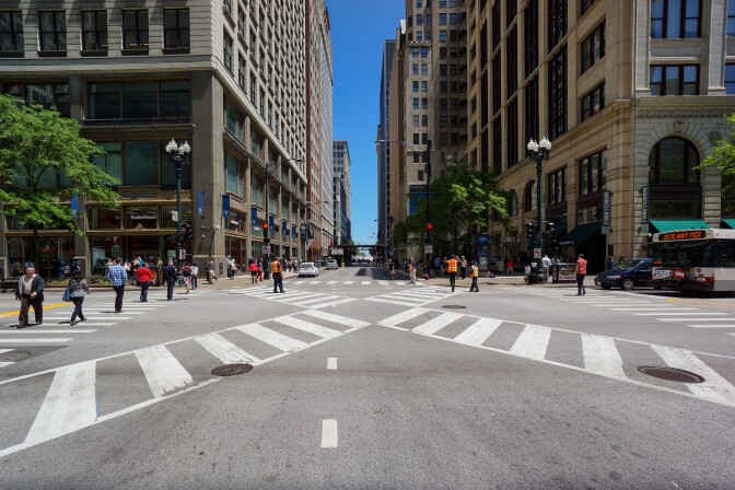 Chicago's first pedestrian scramble, or "Barnes Dance", at the downtown intersection of Jackson Blvd. and State St. Pedestrians are allowed to cross all directions, including diagonally, every three light cycles. All vehicular turns have been prohibited to improve traffic flow. 