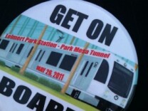 Supporters of a Leimert Park Village stop on the Metro's proposed Crenshaw light rail wear these pins.