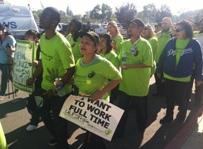 Walmart workers from across SoCal march in front of the Walmart in Paramount, CA.