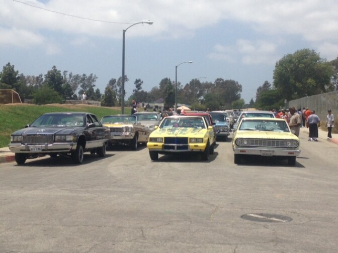 Low-rider car lined up two block down to take part in a monthly "peace ride" event in South LA organized by a group hoping to break rivalries between gangs, neighborhoods and car clubs. 