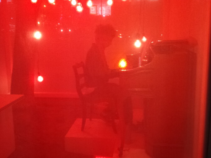 Lima's life in "The Cube" is divided into two parts. "Sunset Piece" goes from 9AM to 5PM and "Red Light Piano Piece" starts at 8PM, after his 5PM tea time and dinner break. 
