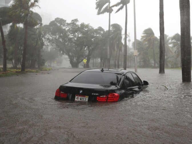 MIAMI, FL - SEPTEMBER 10: A car is seen in a flooded street as Hurricane Irma passes through on September 10, 2017 in Miami, Florida. Hurricane Irma made landfall in the Florida Keys as a Category 4 storm on Sunday, lashing the state with 130 mph winds as it moves up the coast.  (Photo by Joe Raedle/Getty Images)