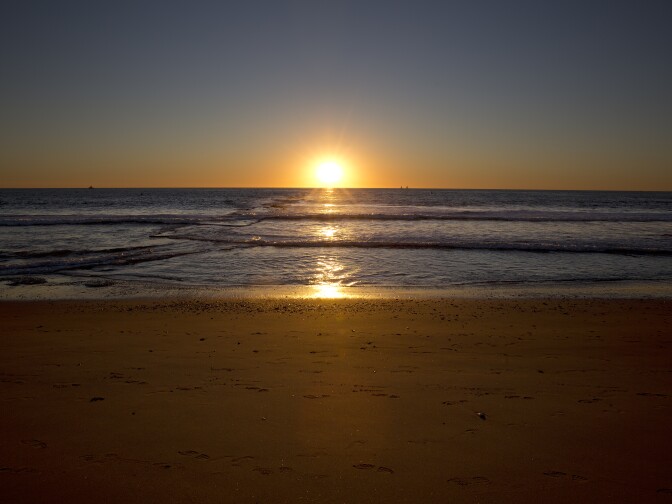 Dockweiler Beach in front of Hyperion Water Reclamation Plant. Sunset on Nov 13th 2015. The line perpendicular to the beach shows the path of the pipeline known as the Hyperion Outfall.
