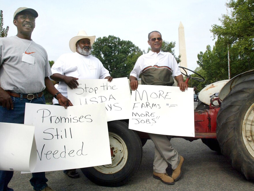 In 2002, five years after a group of black farmers sued the U.S. Department of Agriculture, these men traveled from Manning, S.C., to join a protest outside the USDA.