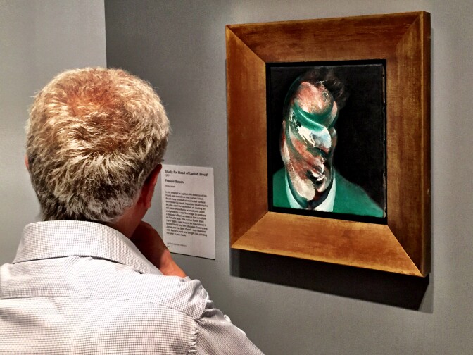 A visitor to the Getty Museum at the opening of London Calling checks out "Study for Head of Lucian Freud," 1967, by Francis Bacon.