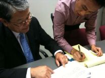 Los Angeles County Chief Executive Officer Bill Fujioka explains his proposed 2011-2012 budget to a reporter at a news briefing at the Hall of Administration.