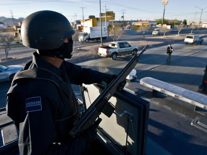 Mexican federal police patrol the streets of Ciudad Juarez during an anti-narcotics operation in March 2009. More than 24,000 Mexicans have died in the country's brutal drug wars since President Felipe Calderon took office in 2006.