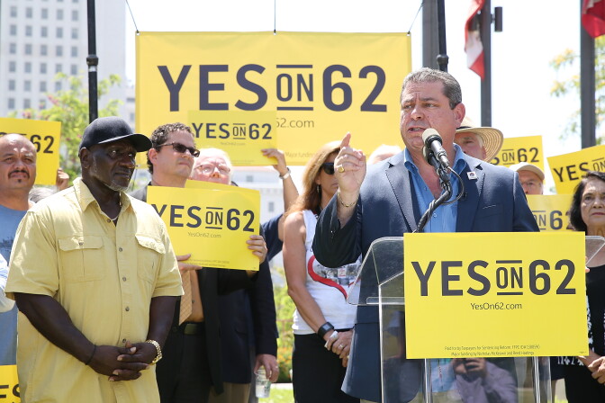 File: Eric Bauman (R) speaks onstage during the Yes on Prop 62 Coalition Announcement at Los Angeles Grand Park on July 14, 2016.