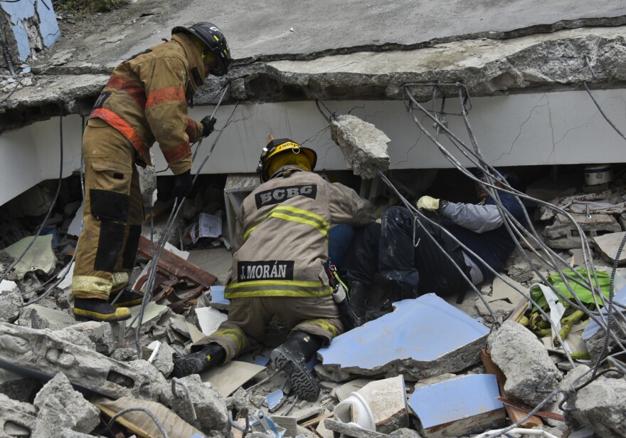 Rescue workers search the rubble after a 7.8-magnitude quake in Gauyaquil, Ecuador on April 17.
