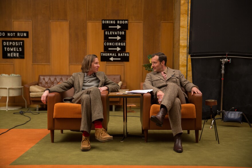 Director Wes Anderson and actor Jude Law talk on set of "The Grand Budapest Hotel."