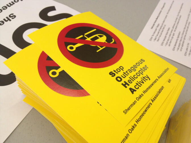 Members of the Sherman Oaks Homeowners Association had yellow stickers printed to show their opposition to helicopters flying over neighborhoods. 