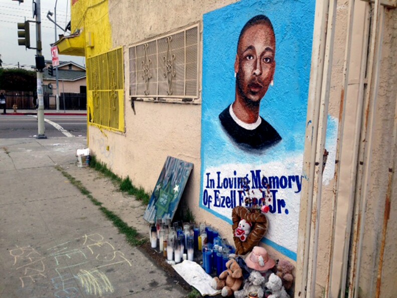 FILE - In this Dec. 30, 2014, file photo,  a street side memorial with a painted portrait of Ezell Ford near where he was shot when police confronted him on Aug. 11, 2014, is shown on a street near his home in South Los Angeles. The Los Angeles police chief and his department’s independent watchdog have found that a fatal close-range shooting of a 25-year-old black man by officers last year was justified, a department source said Friday nigh, June 5, 2015t. However, the findings by Chief Charlie Beck and the inspector general are only recommendations to the Police Commission, which will determine after a hearing next week whether the shooting of Ezell Ford was within department policy (AP Photo/Raquel Maria Dillon, File)