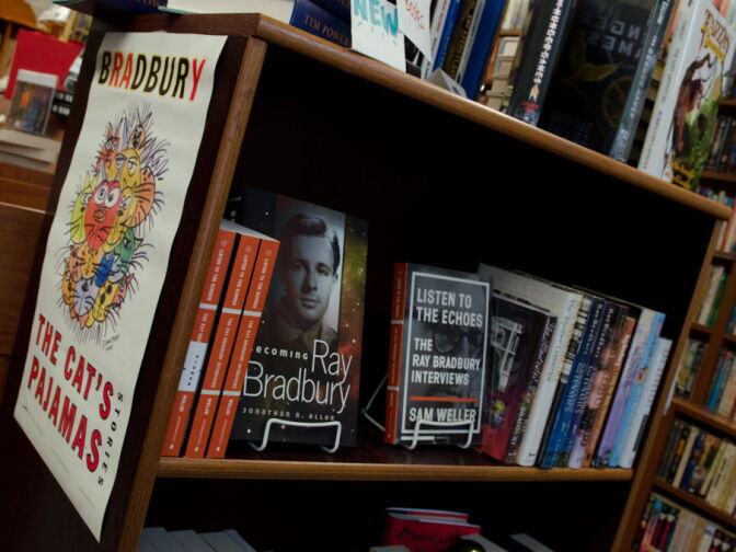 This lucky "The Cat's Pajamas" poster, featuring Bradbury's own art, remains intact, but many of the Bradbury posters in the bookstore have been torn down by fans eager to take home a souvenir during book signings.