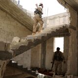 Fighters from Syria's Manbij military council are seen on June 15, 2016 in a building on the outskirts of the northern Syrian town of Manbij, which is held by jihadists of the Islamic State (IS) group, during an operation to try to retake the town.
