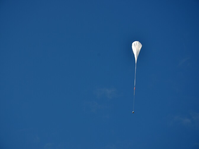 The test vehicle for NASA's Low-Density Supersonic Decelerator rides on a balloon to high altitudes above Hawaii.