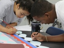 Dalon Poole (right) works on a mural project at the La Pintoresca Teen Education Center in Pasadena.