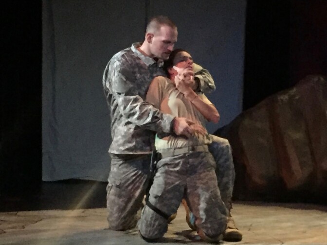 "Sergeant" (played by James Bane) assaults A.J. (Courtney Munch) in "Ajax In Iraq."