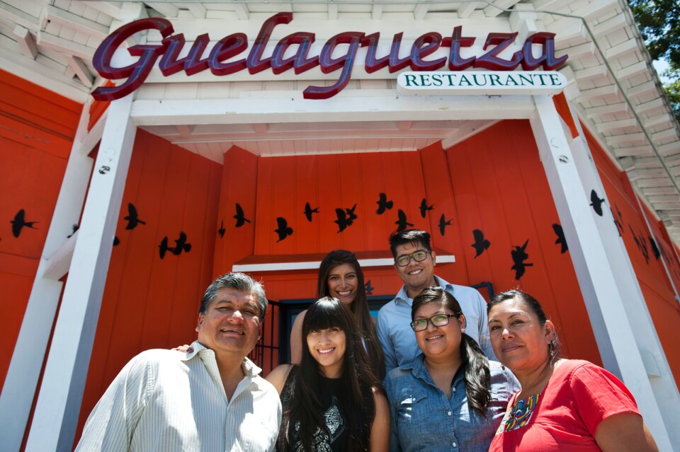 Fernando Lopez, left, his children Elizabeth, Bricia, Fernando, and Paulina Lopez, and wife Maria Monterrubio own Oaxacan restaurant, Guelaguetza. Lopez and Monterrubio are moving back to Oaxaca after 20 years in Los Angeles.