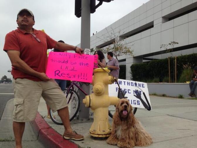 About 20 people were at the Hawthorne Police Department Saturday morning to protest. Many brought their own pets. 