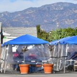 Tents for outdoor dining are seen in a restaurant's parking lot on November 17, 2020 in Alhambra, California, amid the coronavirus pandemic. - US states and cities are imposing a raft of new restrictions to try to curb soaring Covid-19 infection rates. (Photo by Frederic J. BROWN / AFP) (Photo by FREDERIC J. BROWN/AFP via Getty Images)