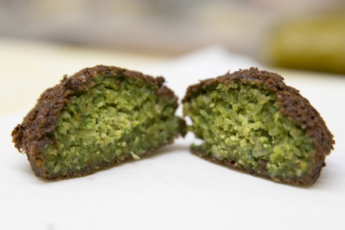 A fresh Falafel cut open at Kareem's Restaurant in Anaheim, California.