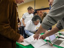 Volunteer and MidCity West neighborhood council member Angie Guzman signs in to take part in the homeless census. She says she hopes the results of the count will turn into action to help the area's homeless. "I would be hopeful that the city does implement some sort of a plan to give them a leg up, in some way, and get them off the street, if that's possible," she said.