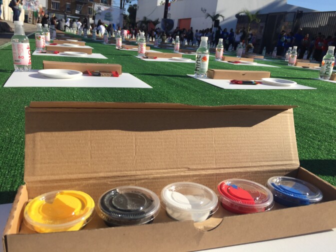 The students were given a piece of charcoal, the three primary colors, and black and white paint to create their individual paintings. 