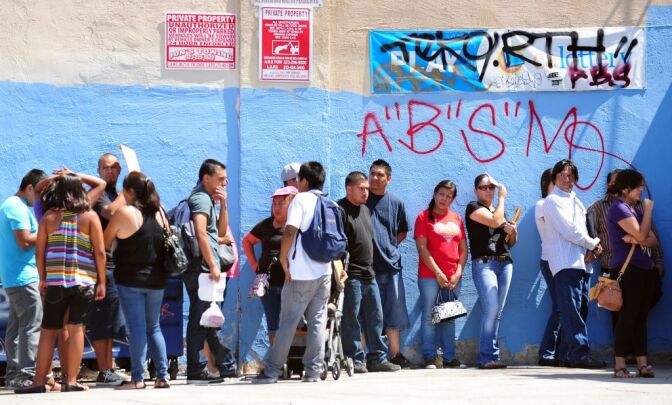 This August 15, 2012 file photo shows young people waiting in line to enter the Coalition for Humane Immigrant Rights of Los Angeles (CHIRLA) office in California, on the first day of the Deferred Action for Childhood Arrivals (DACA) program. Democratic US President Barack Obama failed on his promise of immigration reform, and Republican challenger Mitt Romney has employed harsh rhetoric against illegal immigrants. Now both need the acquittal of Hispanics who feel disillusioned by one and threatened by the other.