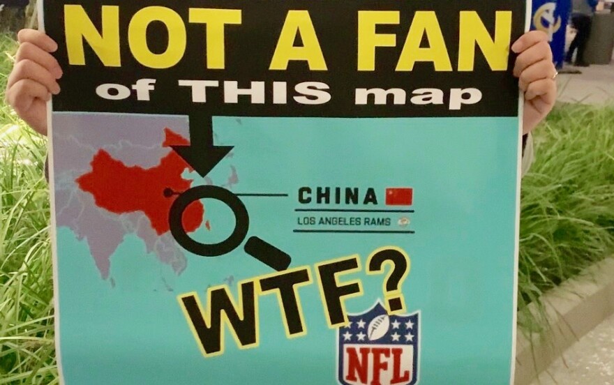 A close-up of a printed sign of an NFL map that reads "Not A Fan of THIS map" accompanied by the abbreviation "WTF."