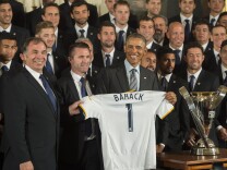 US President Barack Obama (C) poses with L.A. Galaxy Coach Bruce Arena (L) and Irish striker and L.A. Galaxy Captain Robbie Keane (2nd L) during a event in the East Room of the White House in Washington, DC, February 2, 2015.    AFP PHOTO/JIM WATSON        (Photo credit should read JIM WATSON/AFP/Getty Images)