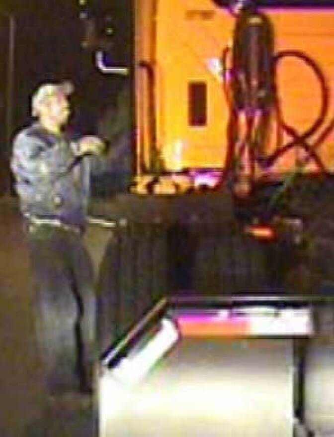Surveillance photo of suspect wanted for the murder of a Riverside police officer.  