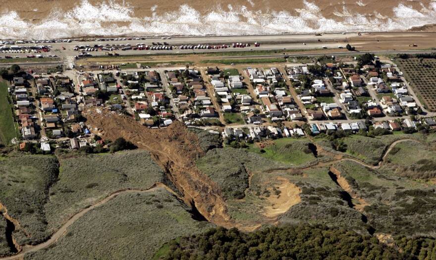 The scene of a large mudslide that on Monday, Jan. 10, 2005, resulted in the deaths of 10 people and the loss of more than a dozen homes, in the coastal community of La Conchito, Calif., is shown Tuesday, Jan. 11, 2005. The community suffered a similar mudslide, killing residents and destroying homes, in 1995. Despite the dangers of living in scenic splendor atop hills or on their slopes, many California homeowners are willing to live with the risks from natural disasters. 