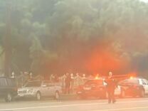 Investigators corral the Northridge home where four were found dead in the Sunday morning fog.