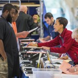 TALLAHASSEE, FL - NOVEMBER 08:  Monique Duncan-Jones, right, with the Leon County Supervisor of Elections, explains balloting procedures to a voter  at the Leon County Courthouse on November 8, 2016 in Tallahassee, Florida, United States. Americans across the nation are picking their choice for the next president of the United States. (Photo by Mark Wallheiser/Getty Images)