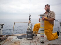 Bill Power of the Sanitation Districts of Los Angeles County prepares to drop a core into the ocean to gather sediment samples in the waters off Palos Verdes. In the 50's and 60's, Montrose chemical company dumped DDT into the water.