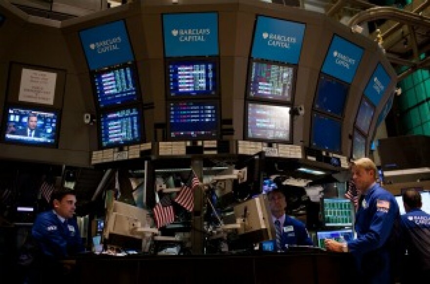 Traders work on the floor of the New York Stock Exchange.